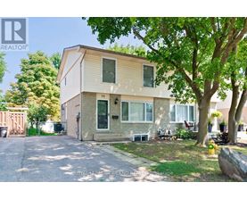 A two-story house with a garage is for sale.