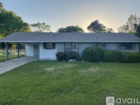 A house with a lawn in front of it is available for sale.
