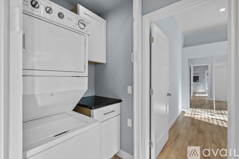 A white oven and dishwasher in a kitchen.