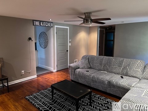A living room with a couch and a coffee table.