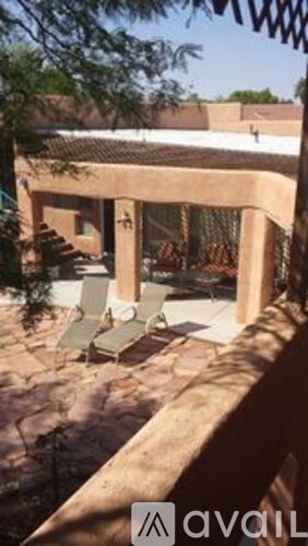 A patio area with a table and chairs is visible.