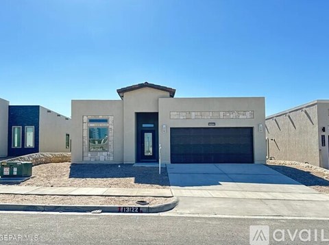 A modern building with a garage door is available for rent.