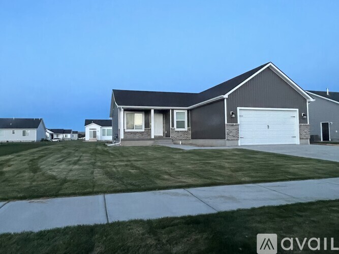 A house with a garage is available for sale.