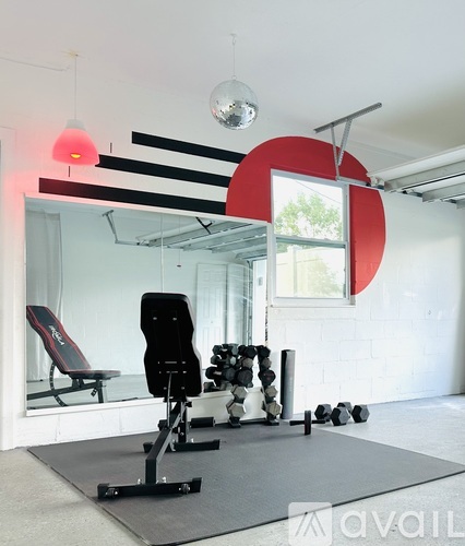 A gym with a red letter C on the wall.