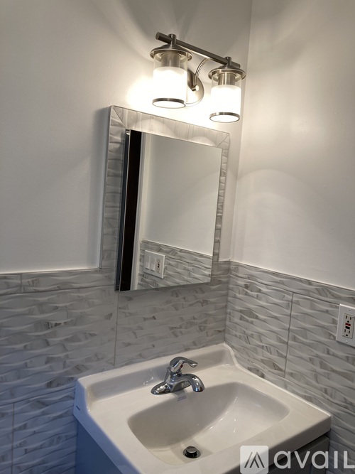 A bathroom sink with a mirror above it.