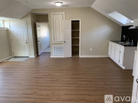 A kitchen area with a sink and cabinets.