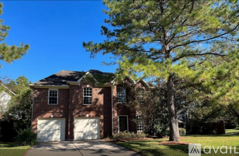 A house with a garage is for sale.