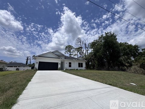 A house with a driveway in front of it.