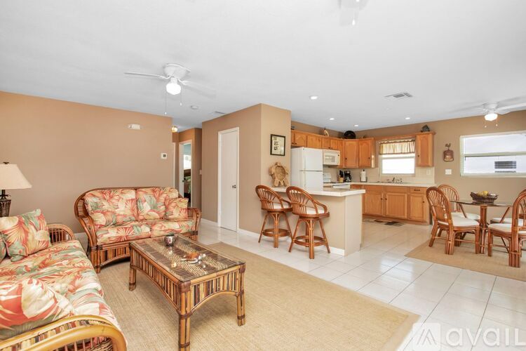 A living room with a sofa, chairs, and a coffee table.