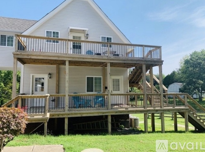 A house with a deck and a balcony.