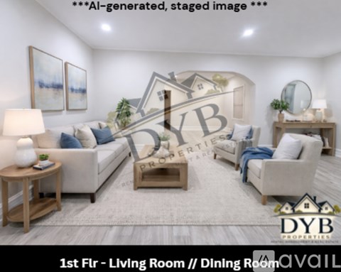 A living room with a couch, coffee table, and a dining table with a lamp on it.