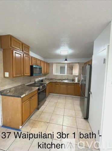 A kitchen with wooden cabinets and a tiled floor.