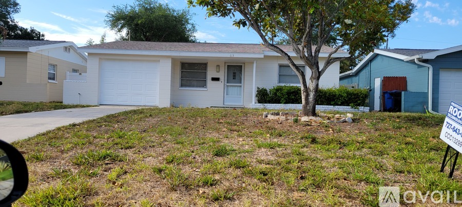 A house with a tree in front of it and a sign that says "available".