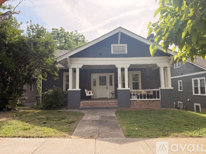 A house with a front porch and a covered entrance.