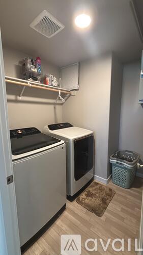 A small kitchen with a dishwasher and a microwave.