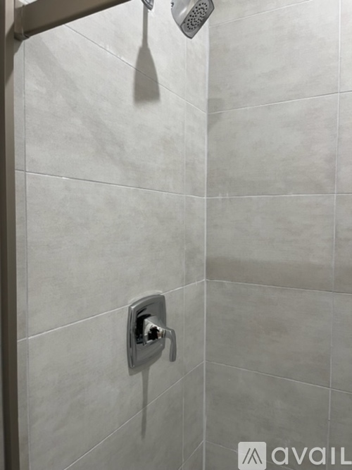 A shower head mounted on a wall.