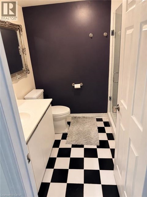 A black and white checkered bathroom floor.