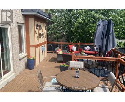 A patio with a table and chairs and a couch.