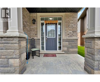 A house entrance with a REALTOR sign.