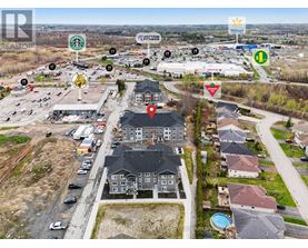 A bird's eye view of a neighborhood with a Walmart in the background.