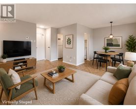 A living room with a couch, chair, and coffee table.