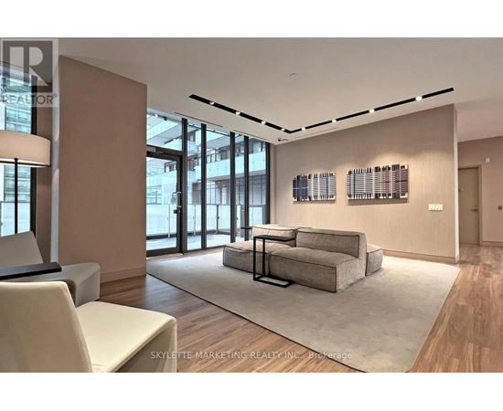 A modern living room with a large sectional sofa and a coffee table.