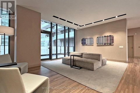 A modern living room with a large sectional sofa and a coffee table.