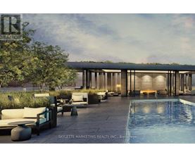 A modern outdoor seating area with a pool and a building in the background.