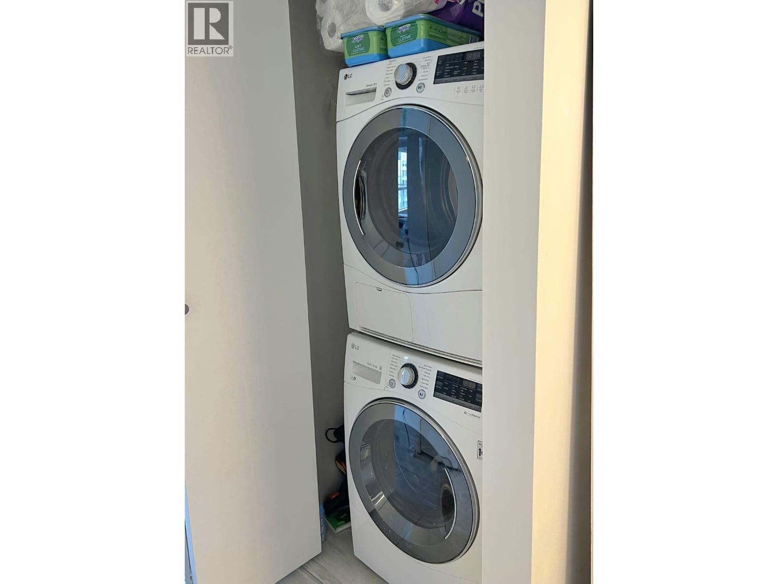 Two washing machines in a small space.