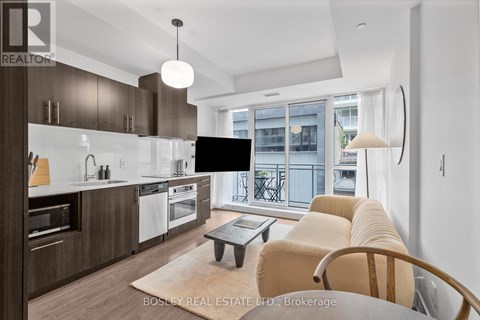 A modern kitchen with a dining table and chairs.
