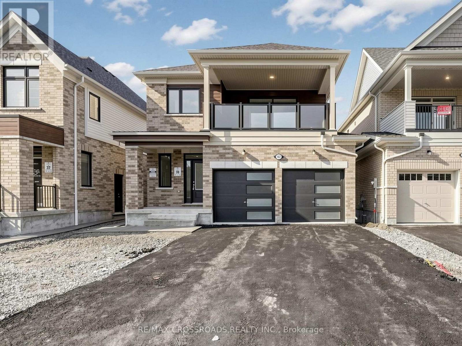 A modern two-story house with a garage is for sale.