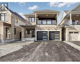 A modern two-story house with a garage is for sale.