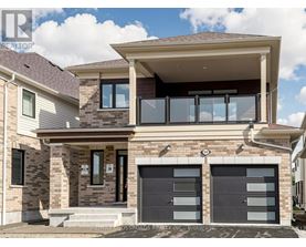 A modern house with a garage is for sale.