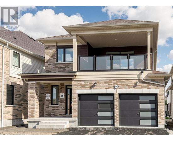 A modern house with a garage is for sale.