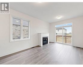 A spacious living room with a fireplace and sliding glass doors.