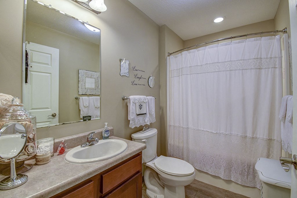 a bathroom with a sink toilet and a shower