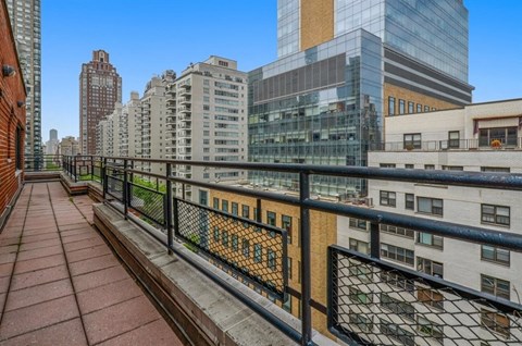 the view from the balcony of a condo in the city