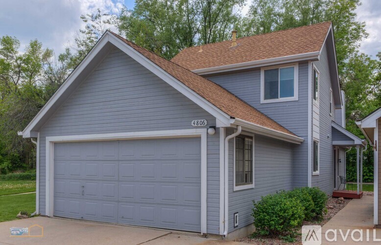 A two-car garage is attached to a house.