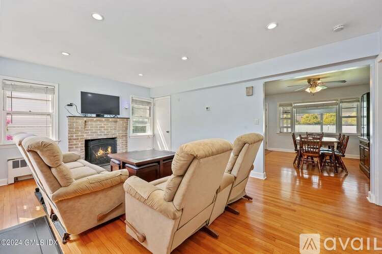 A living room with two recliner chairs and a fireplace.