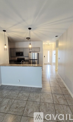 A kitchen with a countertop and a sink is available for rent.