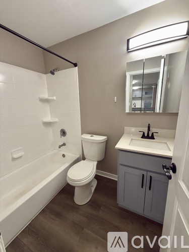 A bathroom with a white toilet and sink.