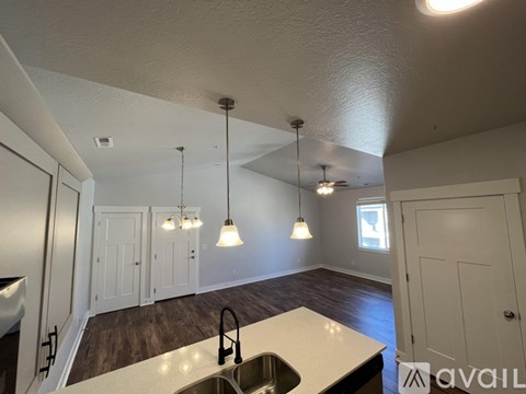 A kitchen with a sink and a window.