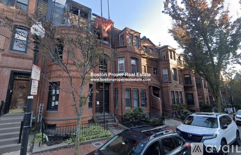 A building with the text "Boston Proper Real Estate" on it.