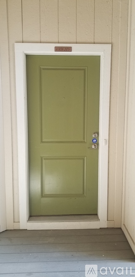 A white door with a red label on it.