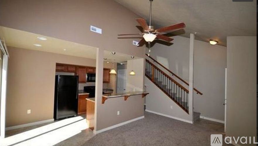 A living room with a staircase leading to the upper floor.
