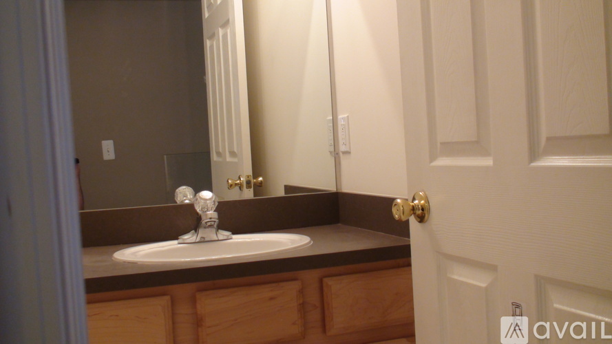 A bathroom with a sink and mirror.