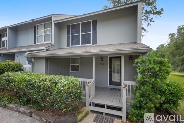 A house with a porch and a sign that says "available".