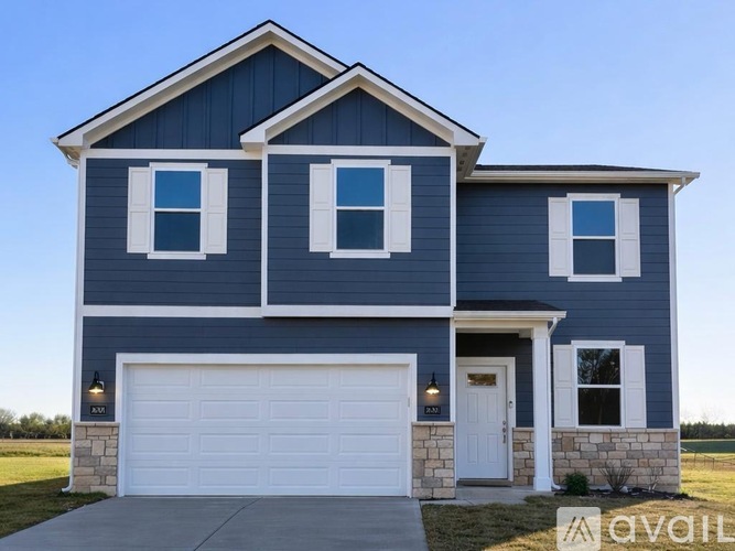 A two-story house with a garage and a white door.