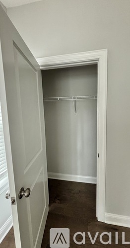 A white door with a glass window in the middle of it.