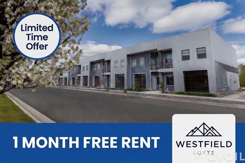 A modern building with a sign offering a free one month rent.
